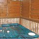Deck View with Hot Tub of Cabin 206 (Mountain Rendezvous) at Eagles Ridge Resort at Pigeon Forge, Tennessee.