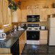 Fully furnished kitchen in cabin 235 (Romantic Retreat , in Pigeon Forge, Tennessee.