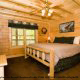 Bedroom View with TV Set of Cabin 260 (Magical Moments) at Eagles Ridge Resort at Pigeon Forge, Tennessee.