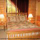 Bedroom with Queen Size Bed in Cabin 43 (The Great Escape) at Eagles Ridge Resort at Pigeon Forge, Tennessee.