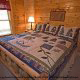 Country bedroom in cabin 807 (Blackbeary Ridge) at Eagles Ridge Resort at Pigeon Forge, Tennessee.