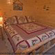 Country bedroom in cabin 807 (Blackbeary Ridge) at Eagles Ridge Resort at Pigeon Forge, Tennessee.