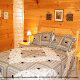 Country bedroom in cabin 813 (Heavenly View) at Eagles Ridge Resort at Pigeon Forge, Tennessee.