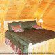 Country bedroom in cabin 813 (Heavenly View) at Eagles Ridge Resort at Pigeon Forge, Tennessee.