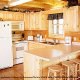 Country kitchen with bar in cabin 853 (Beary Cozy) at Eagles Ridge Resort at Pigeon Forge, Tennessee.