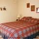 Country pine bedroom in cabin 861 (Mountain View Lodge) at Eagles Ridge Resort at Pigeon Forge, Tennessee.
