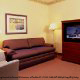 Living Room View at Country Inn & Suites By Carlson Orlando-Maingate at Calypso in Orlando, Florida. Our Hotel offers all the conveniences you need for a pleasant New Years vacation.