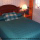Another country decorated bedroom at the Country Pines Log Home Resort in Pigeon Forge Tennessee