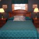 A master bedroom in blue at the Country Pines Log Home Resort in Pigeon Forge Tennessee