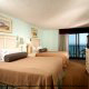View of a double bedroom with an ocean view from a private balcony at The Best Western Carolinian in Myrtle Beach