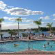 Outdoor Pool with Chaise Lounge Chairs at Summer Bay Resort in Orlando, Florida.